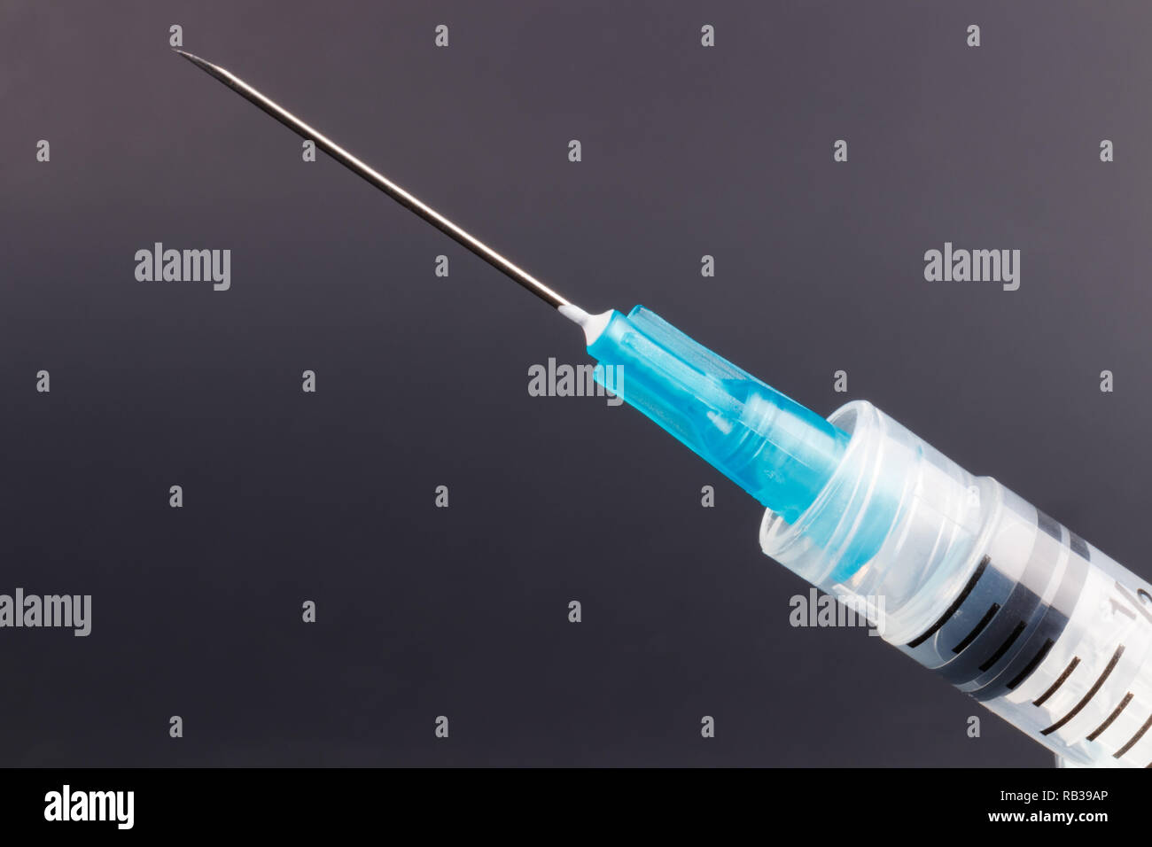 Close up view of a syringe with hypodermic needle. Opiate and heroin overdoses have skyrocketed in recent years I Stock Photo
