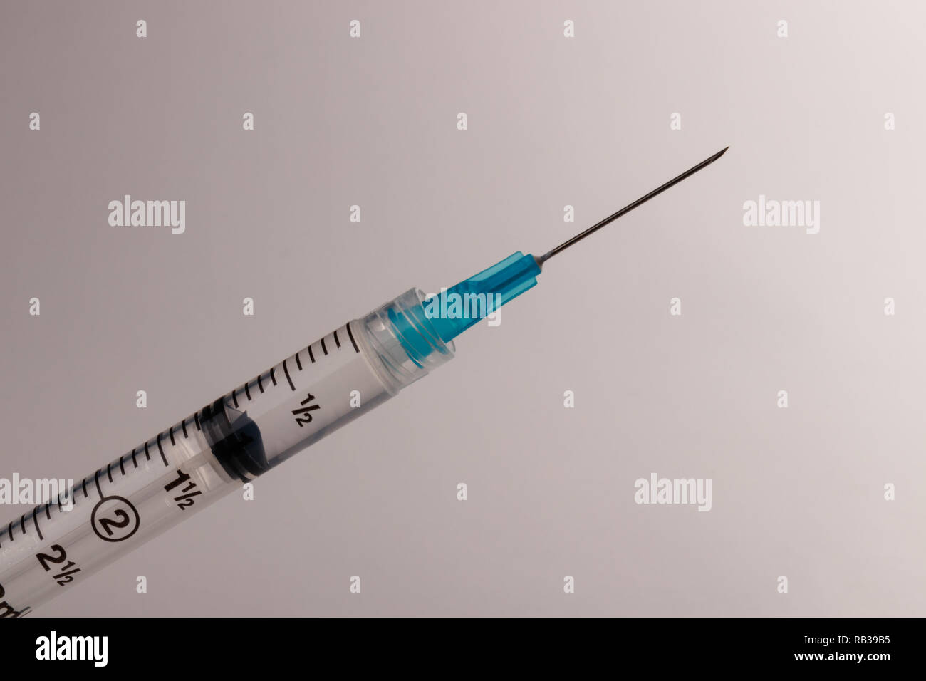 Close up view of a syringe with hypodermic needle. Opiate and heroin overdoses have skyrocketed in recent years III Stock Photo