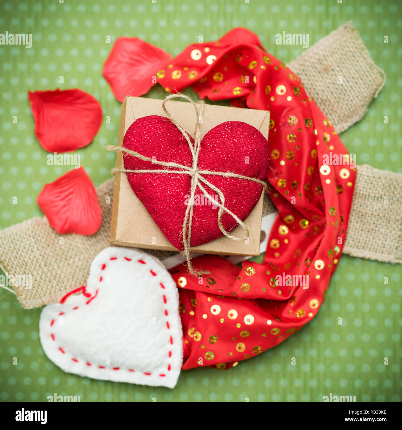 Red heart on green polka dot background Stock Photo