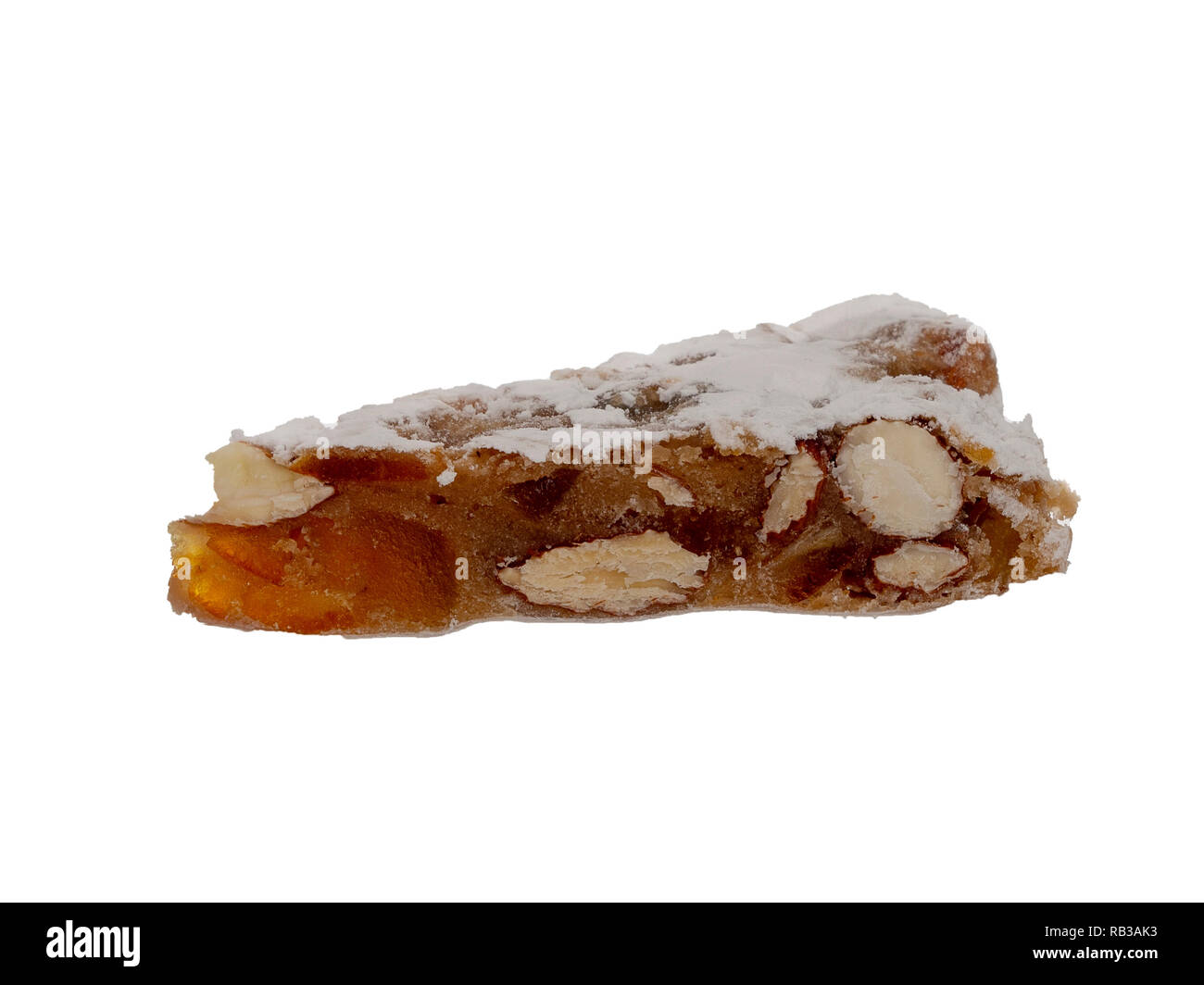 Panforte slice, isolated on white, Italian Christmas sweet dessert, cake make with dried fruits and nuts. Stock Photo
