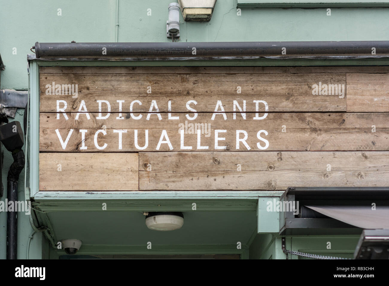 A shop sign in Islington, London: Esence of Islington? Radicals and Victuallers Stock Photo
