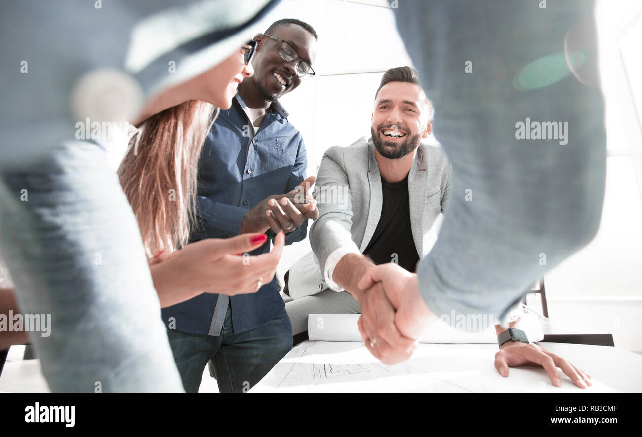 close up.architect and customer shaking hands Stock Photo