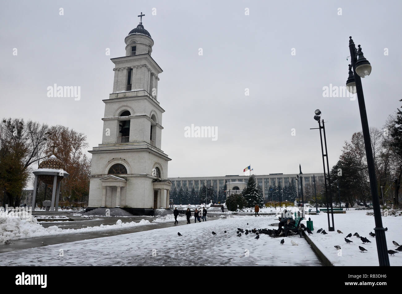 Bell tower and Government House in the snow, Cathedral Park, Chisinau (Kishinev), Republic of Moldova, November 2018 Stock Photo