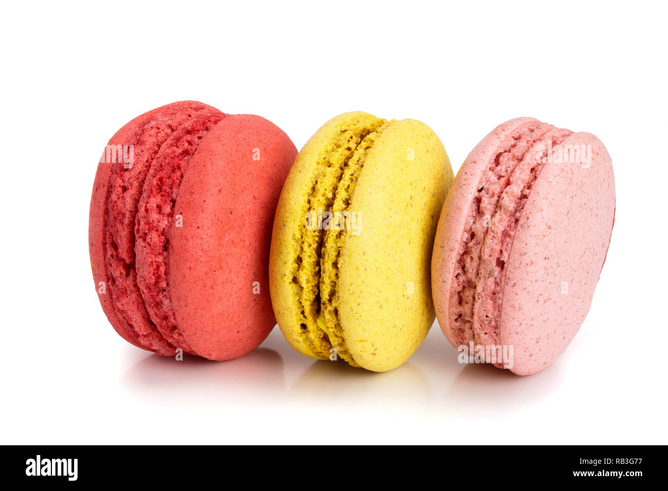 three macaroons isolated on white background closeup Stock Photo