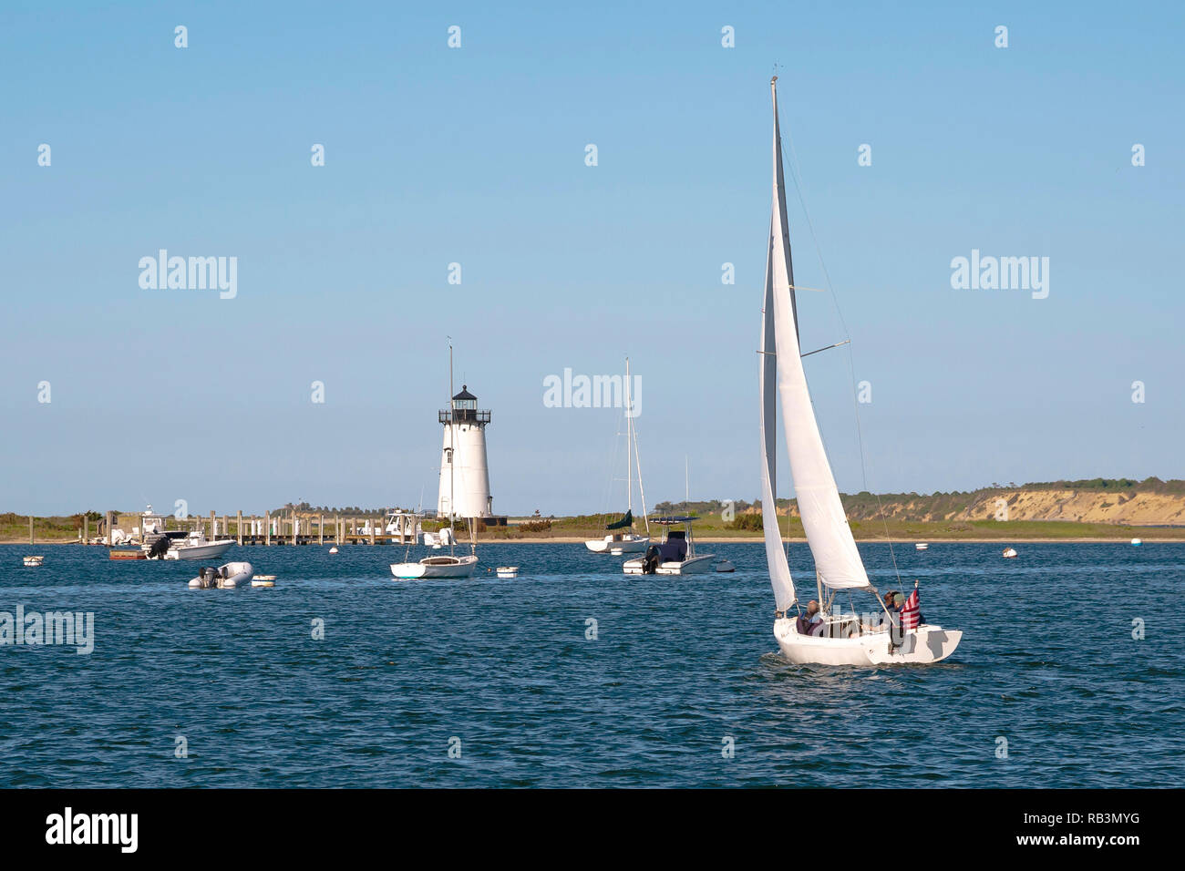 Sailing in Edgartown harbor by Edgartown lighthouse on Martha’s