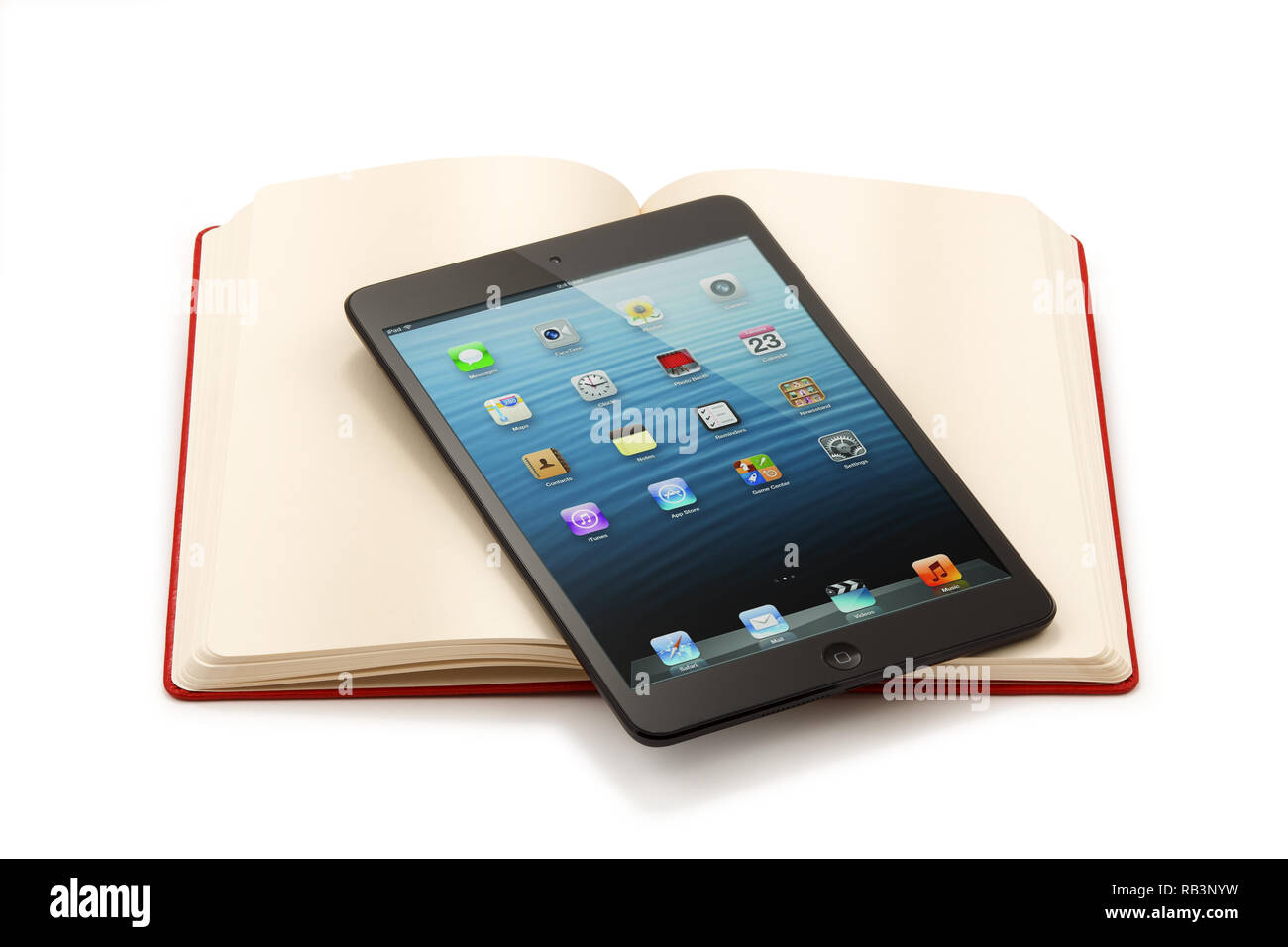 Ipad Mini On Open Book Clipping Path Maximum Size Stock Photo Alamy