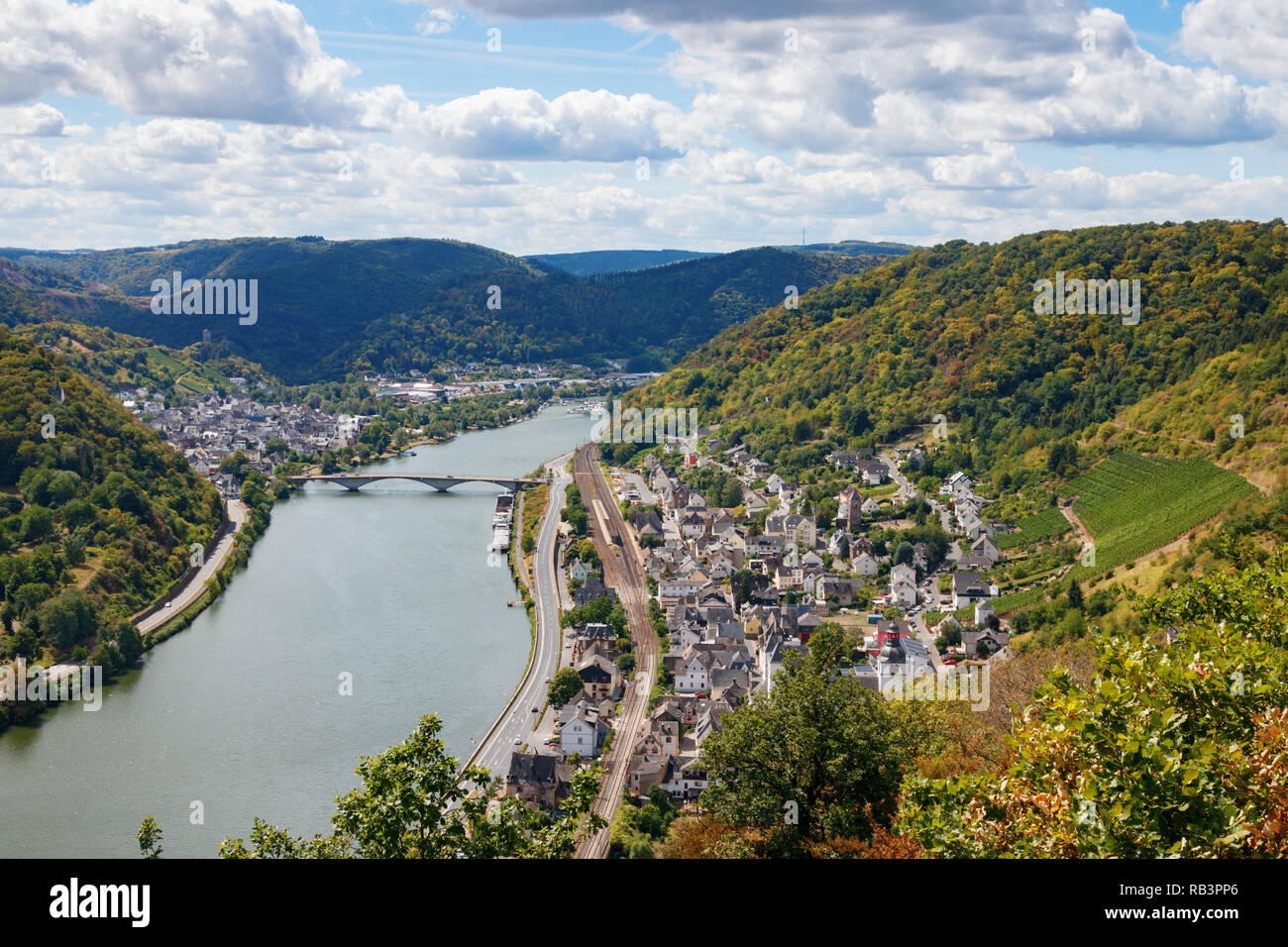 Aerial view of the Treis-Karden municipality, the river Moselle and the surrounding hills on a sunny day. Cochem-Zell, Rhineland-Palatinate, Germany. Stock Photo