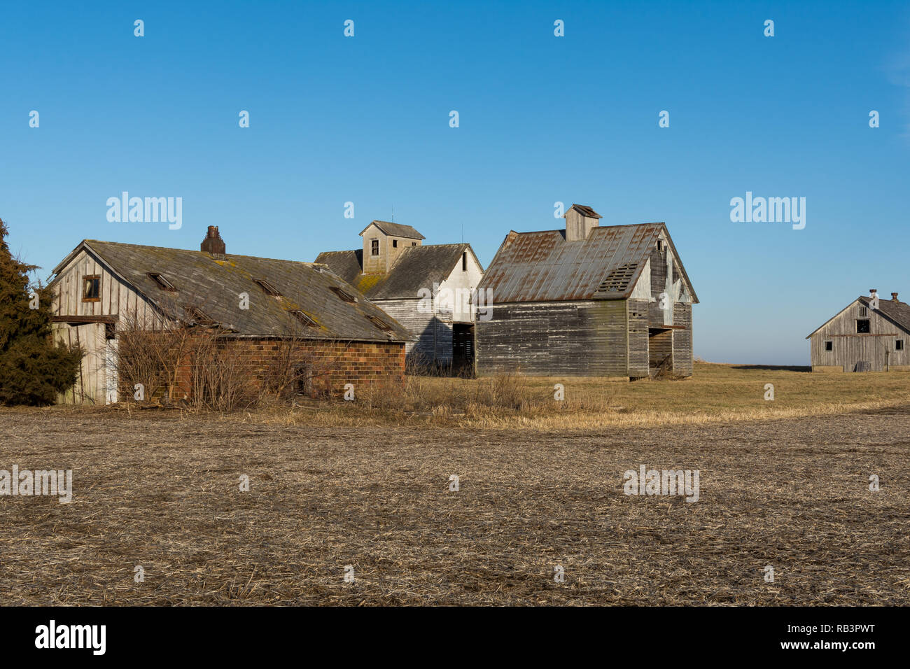 Old wooden barns in the open farmland. LaSalle County, Illinois, USA