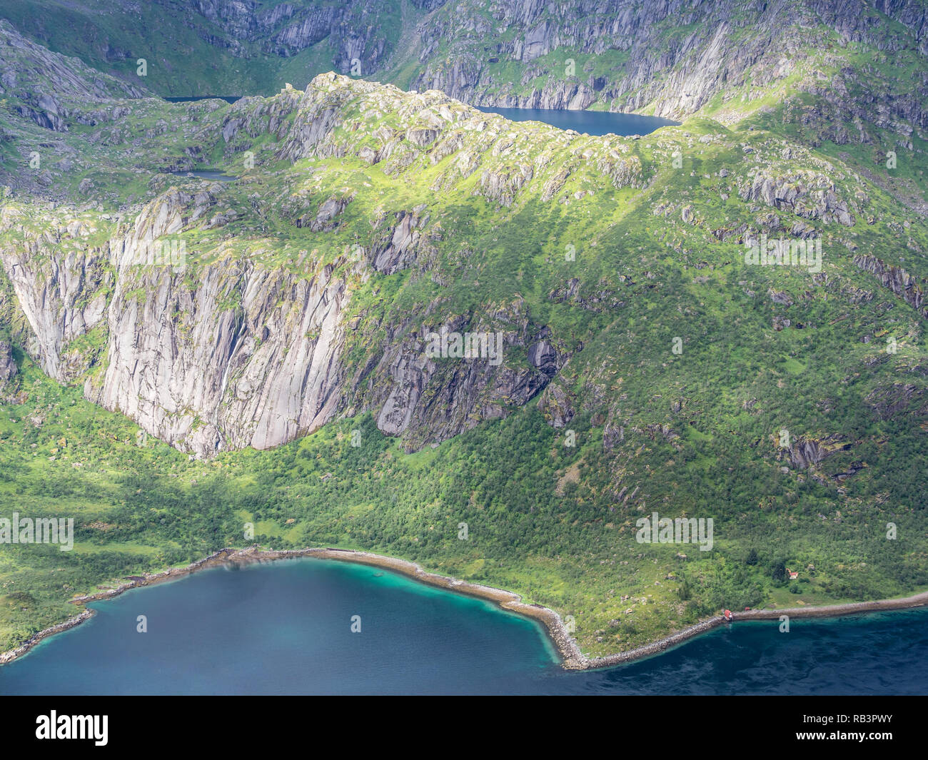 View from mountain range above village Raften down to shore at the Raftsund, the strait between islands  Hinnøya and Austvågøya, rock formations on th Stock Photo
