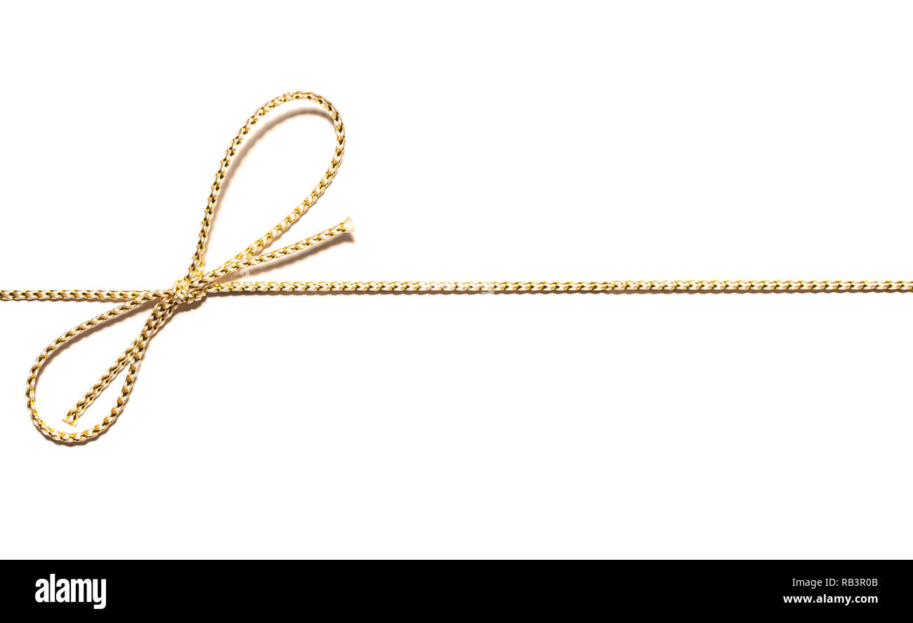 Golden satin rope parallel to frame with knotted bow gift ribbon wrap ...