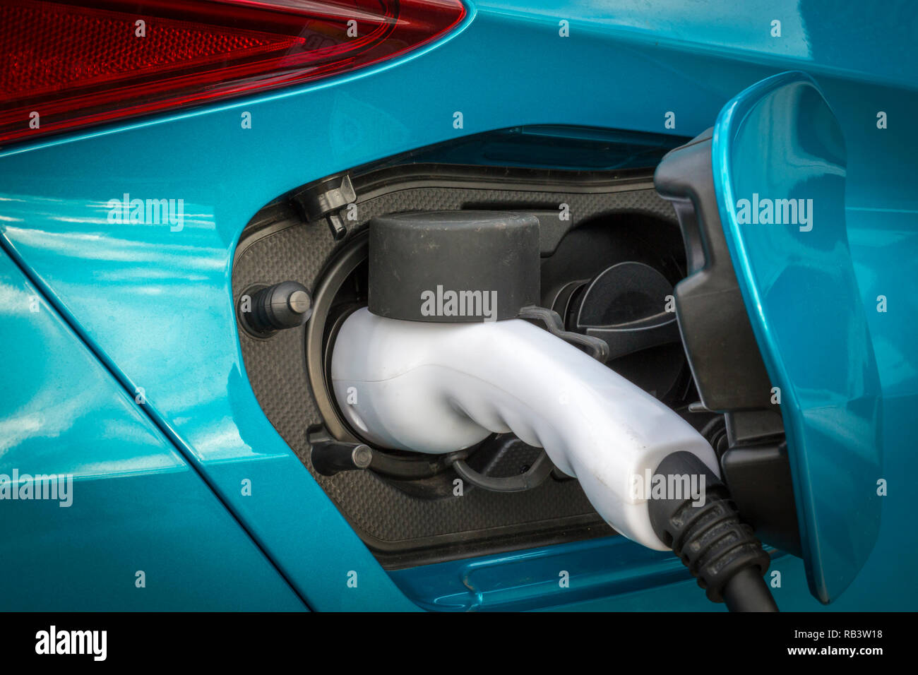 Electric car on charge Stock Photo
