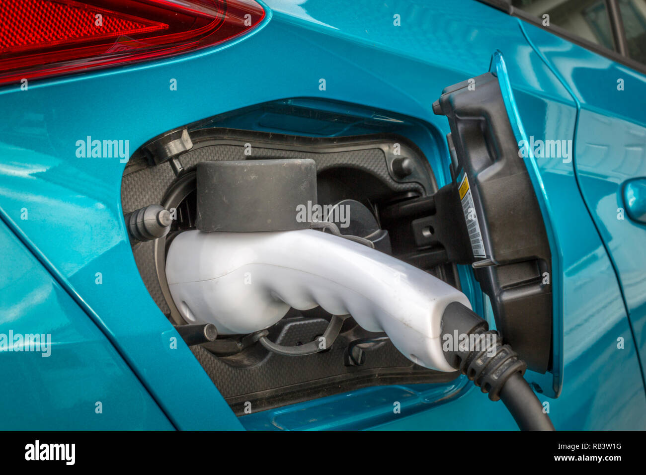 Electric car on charge Stock Photo