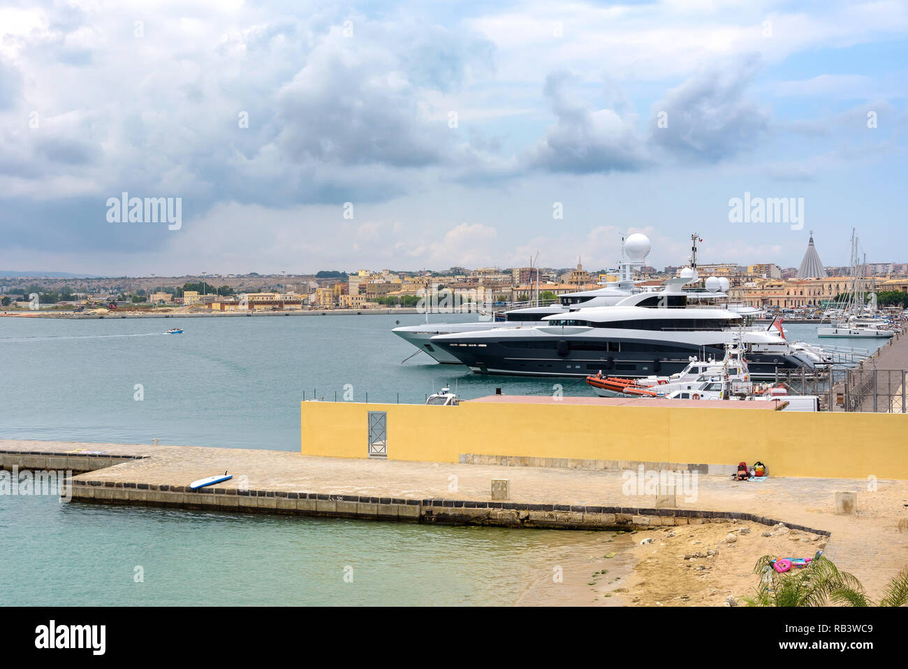 Luxury yachts moored in the port on Ortygia Islands in Syracuse, Sicily, Italy Stock Photo