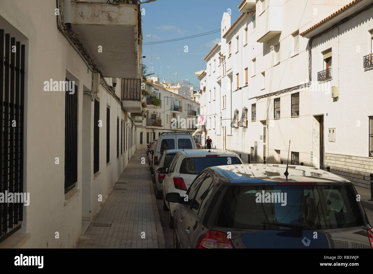 Cars parked along street in Altea, Spain. Stock Photo