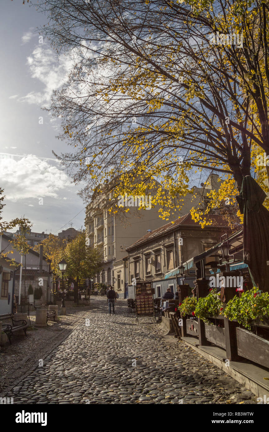 BELGRADE, SERBIA - NOVEMBER 17, 2014: Skadarlija street (also known as Skadarska) at fall with its typical cobblestone pavement cafes and restaurants  Stock Photo