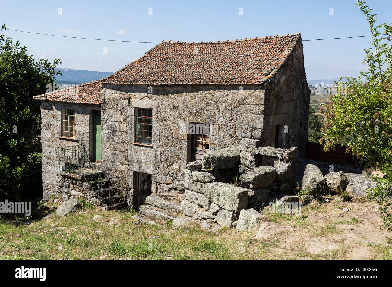 Traditional local granite house of the rural architecture of the Beira Alta region in Portugal Stock Photo