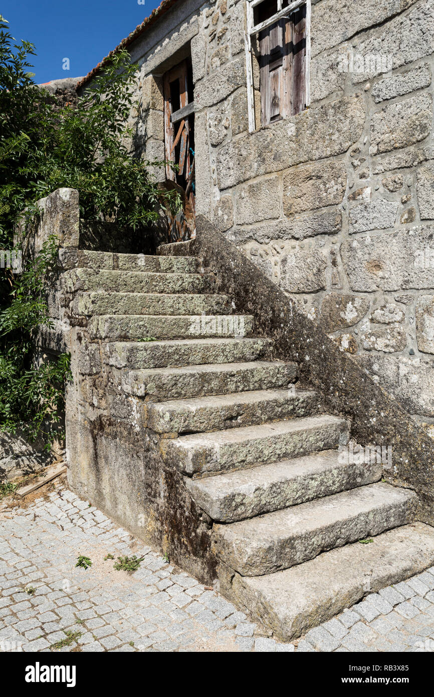 Traditional local granite house of the rural architecture of the Beira Alta region in Portugal Stock Photo