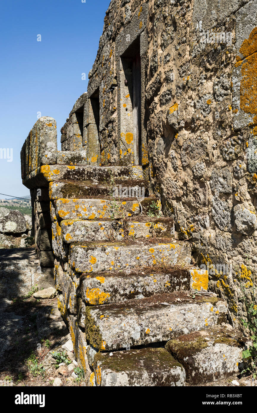Staircase of a traditional local granite house of the rural architecture of the Beira Alta region in Portugal Stock Photo