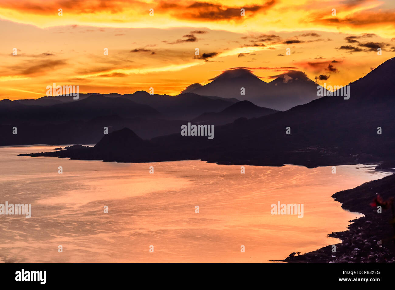 Sunrise over Lake Atitlan & 3 volcanoes. View from Indian Nose, San