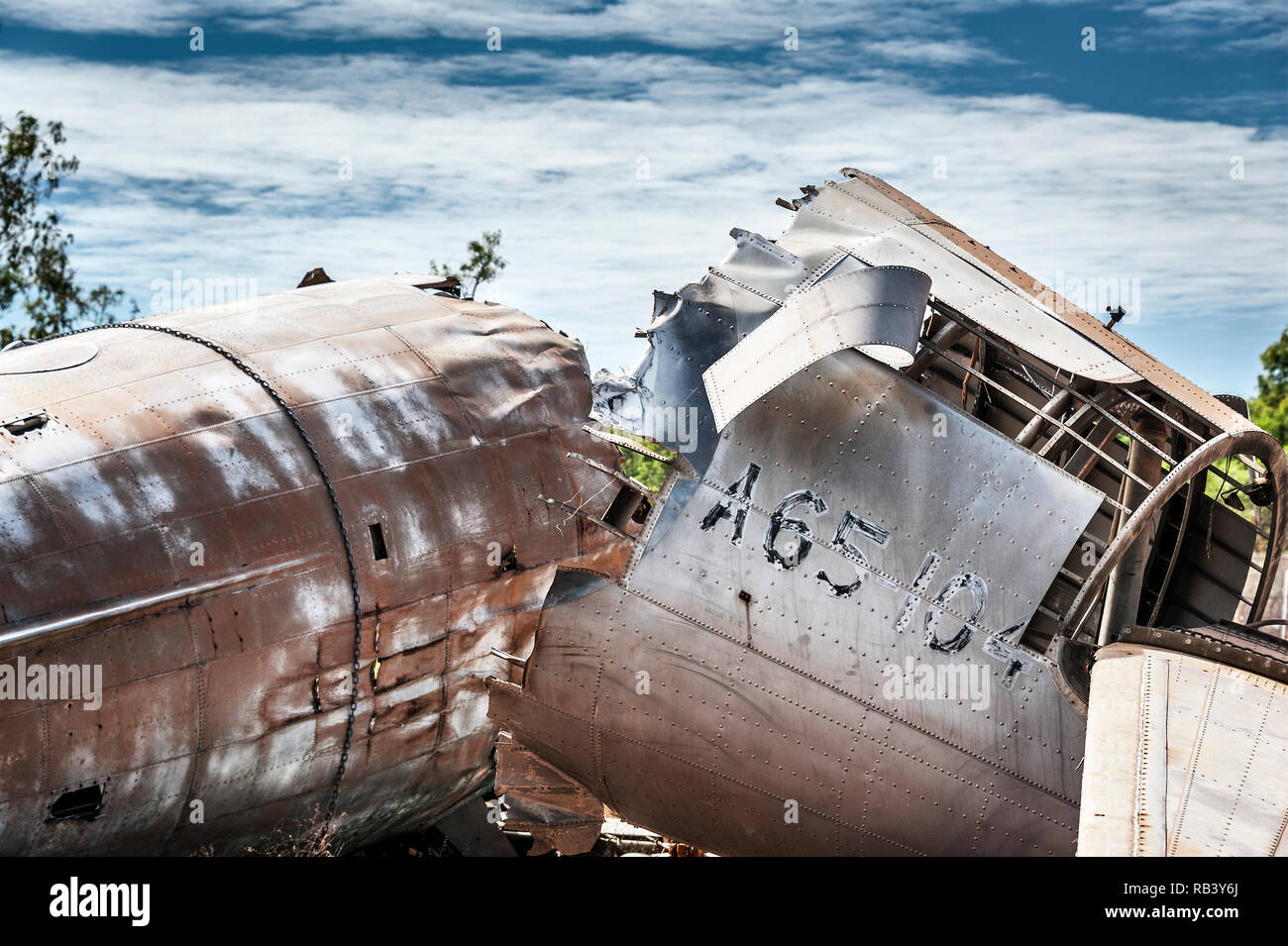 Broken fuselage of an abandoned plane, rusted and the internal framing exposed Stock Photo