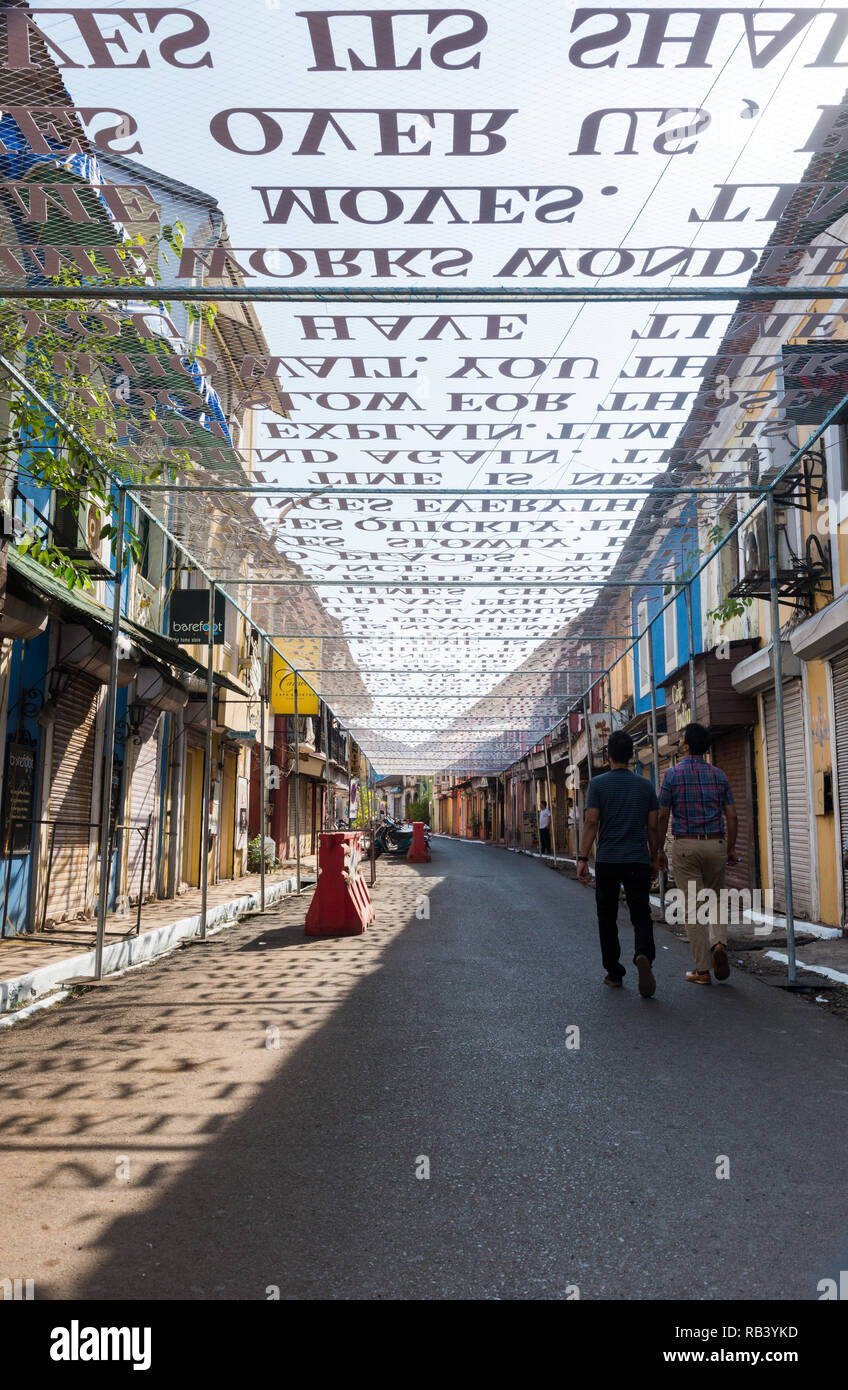 Goa, India - Dec 18, 2018: An art installation as part of the Serendipity Art Festival in Goa, India. Cutout words are suspended over a public road Stock Photo