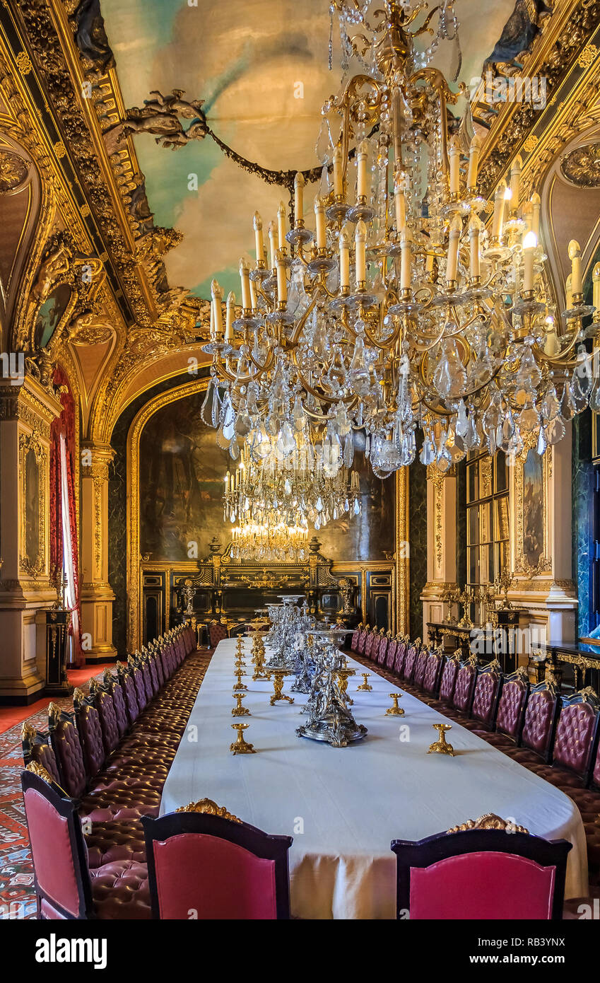 Paris, France - October 25, 2013: Banquet table in Napoleon III  apartments, Louvre Museum with luxury baroque furnishings and stunning chandelier Stock Photo