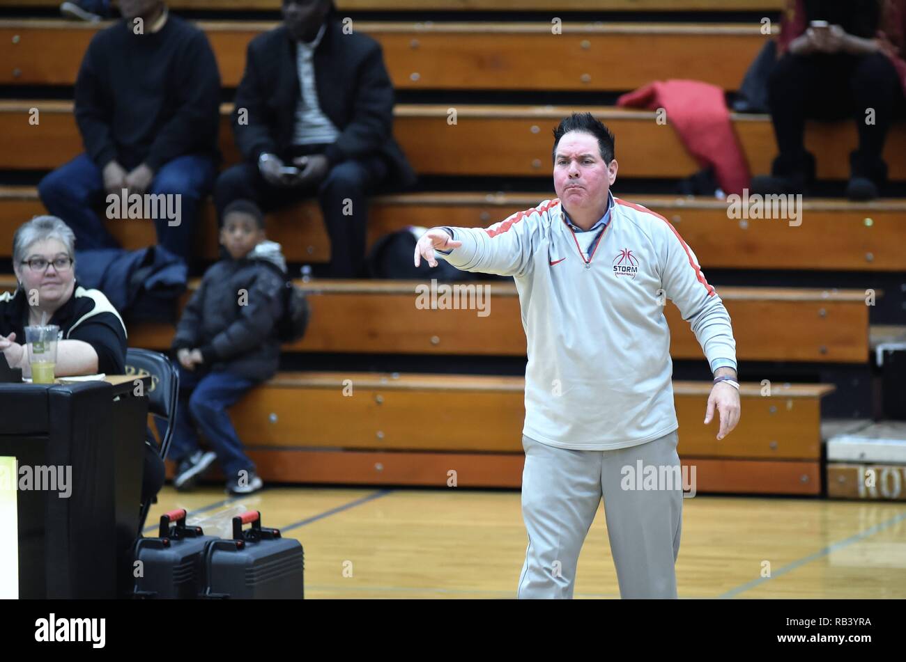 Streamwood, Illinois, USA. Coach reacting with disagreement to an official's call made on the floor. Stock Photo