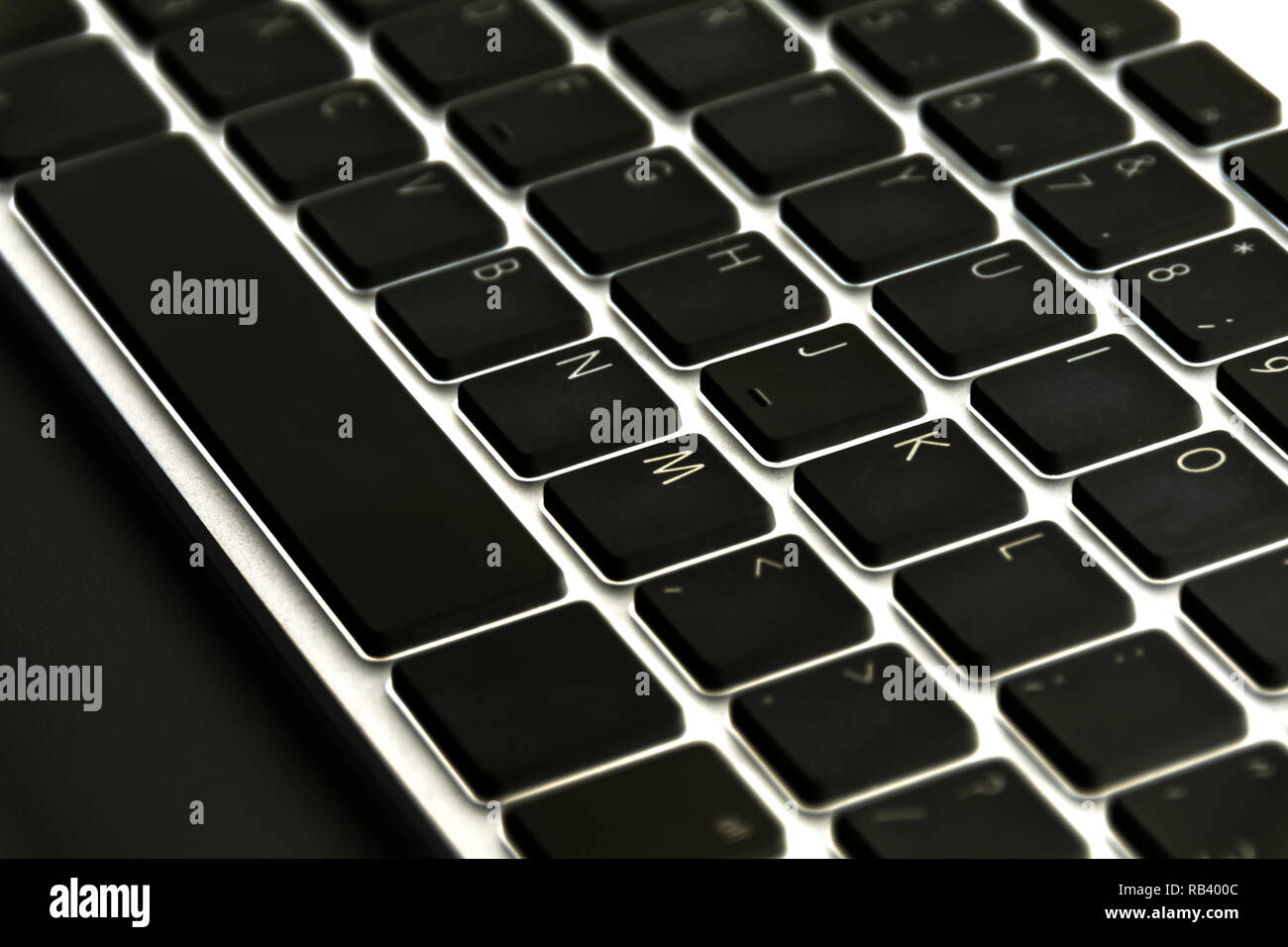 Close up view of a computer keyboard keys on black table Stock Photo ...