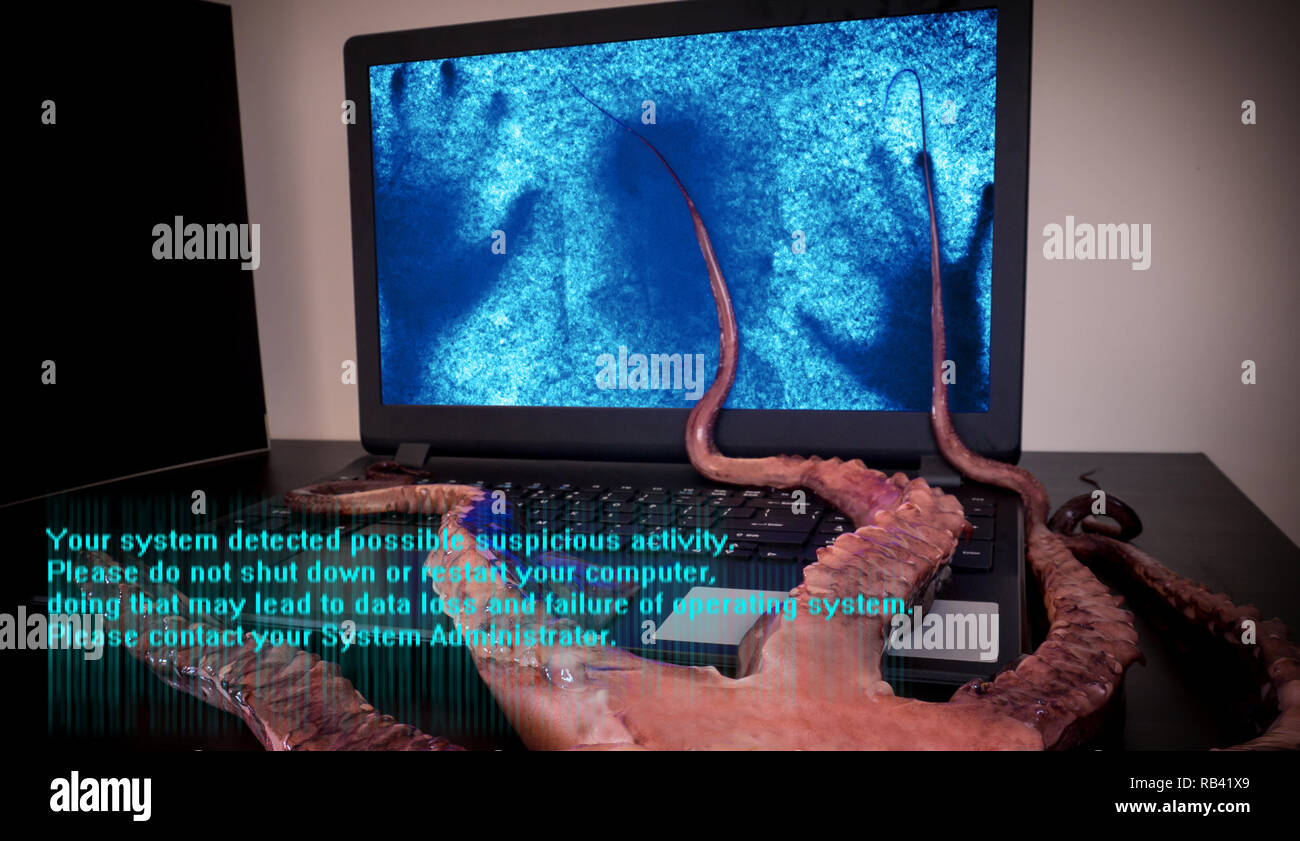 Computer virus concept. Laptop with man inside seized by disgusting monster with long sticky tentacles. Data loss danger. Stock Photo