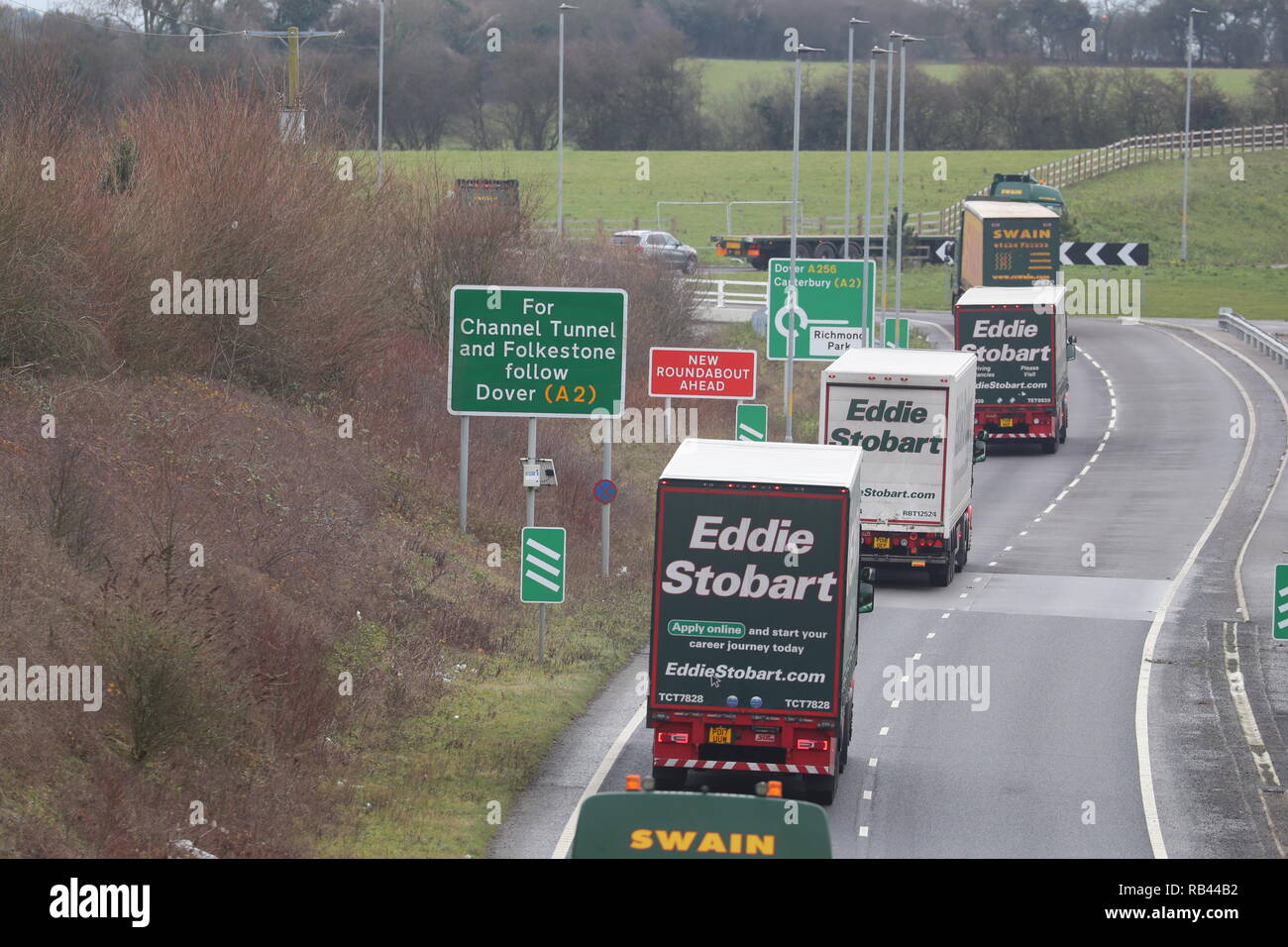 Lorries on the A526 outside Dover during the second of two trials at the former Manston Airport site in Kent of a government plan to hold lorries in the event of post-Brexit disruption at the channel ports. Stock Photo