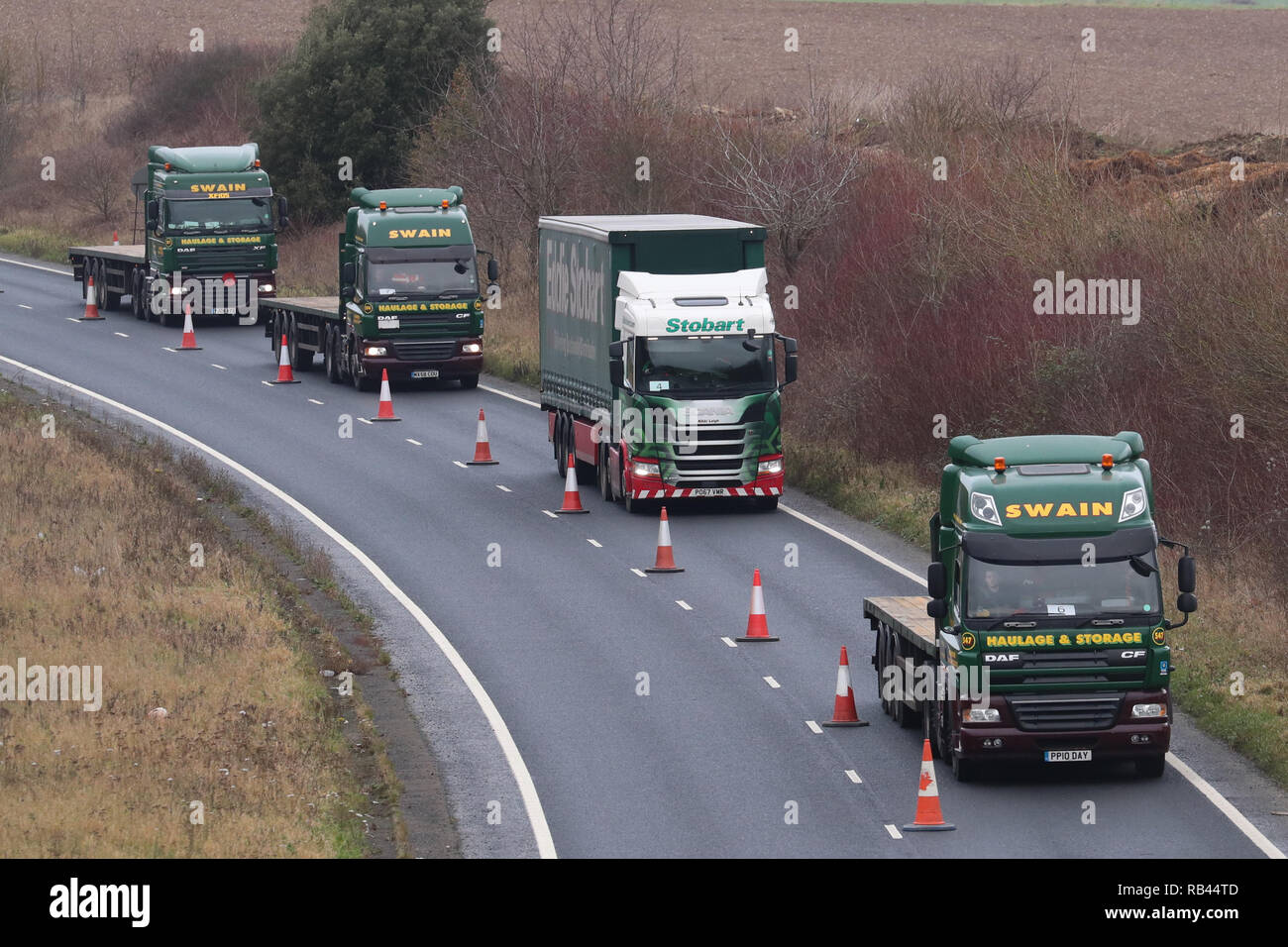 Lorries form up on the A256 outside Dover for the second of two trials at the former Manston Airport site in Kent of a government plan to hold lorries in the event of post-Brexit disruption at the channel ports. Stock Photo