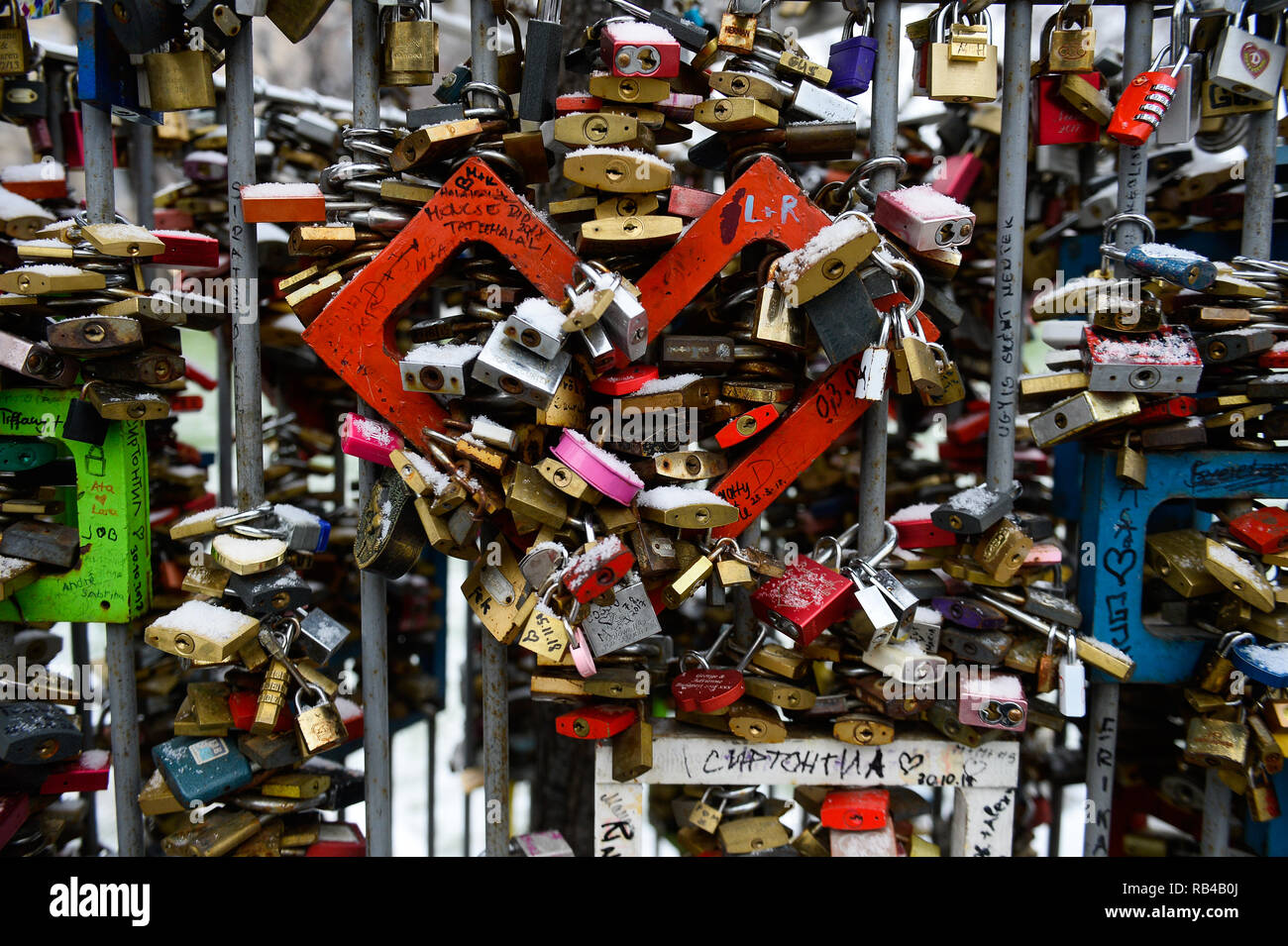 Love locks are seen around a metal heart in the city center of Budapest