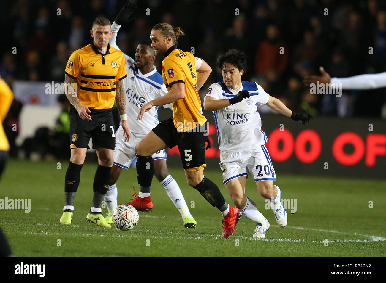 Newport, UK. 06th Jan, 2019. Fraser Franks of Newport County (5) breaks away from Shinji Okazaki of Leicester City (20). The Emirates FA Cup, 3rd round match, Newport county v Leicester City at Rodney Parade in Newport, South Wales on Sunday 6th January 2019. this image may only be used for Editorial purposes. Editorial use only, license required for commercial use. No use in betting, games or a single club/league/player publications. pic by Andrew Orchard/Andrew Orchard sports photography/Alamy Live news Credit: Andrew Orchard sports photography/Alamy Live News Stock Photo