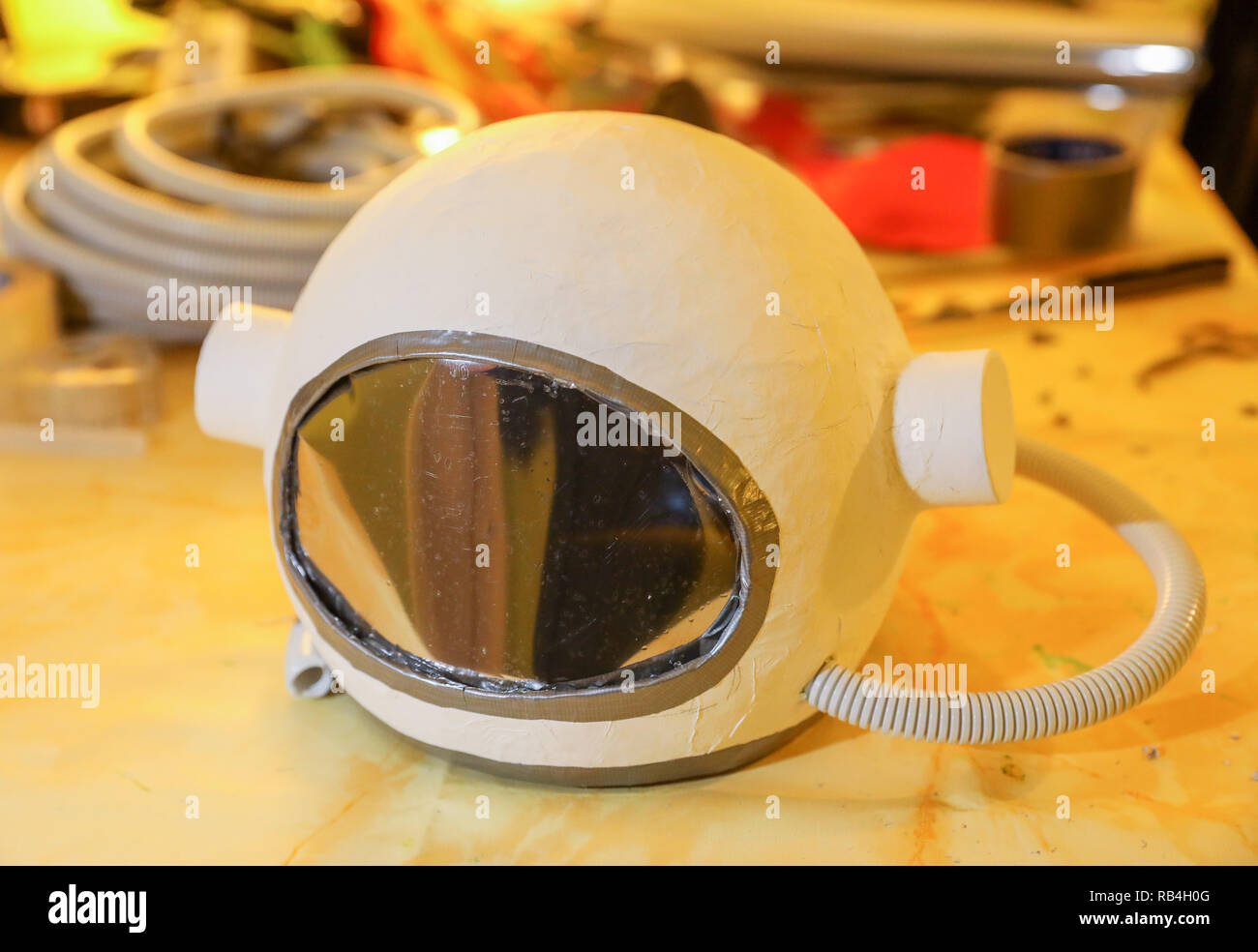 Leipzig, Germany. 11th Feb, 2018. An astronaut's helmet made of papier-mâché  to a costume for an astronaut lies on a table. Credit: Jan  Woitas/dpa-Zentralbild/ZB/dpa/Alamy Live News Stock Photo - Alamy