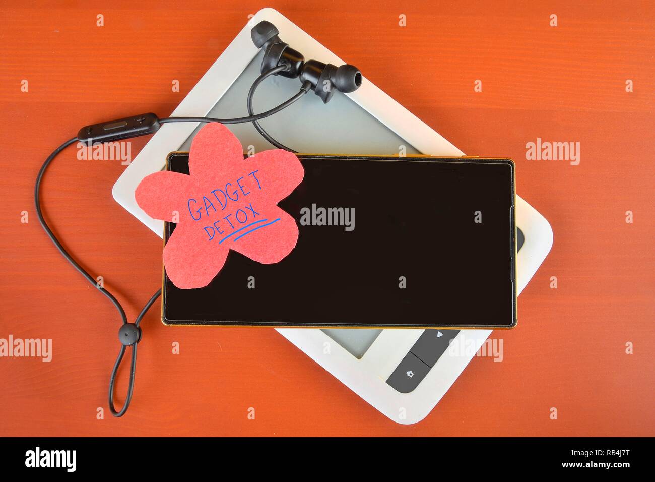 Gadget detox concept. Digital addiction concept. Mobile phone, ebook