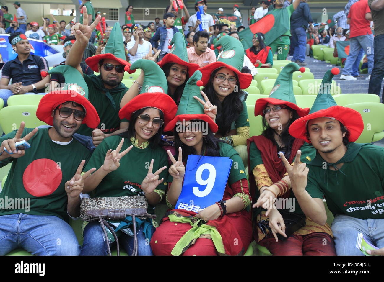 Bangladesh fans flash the V-sign during the ICC Cricket World Cup 2011 against Ireland at the Sher-e-Bangla National Stadium. Dhaka, Bangladesh. Stock Photo