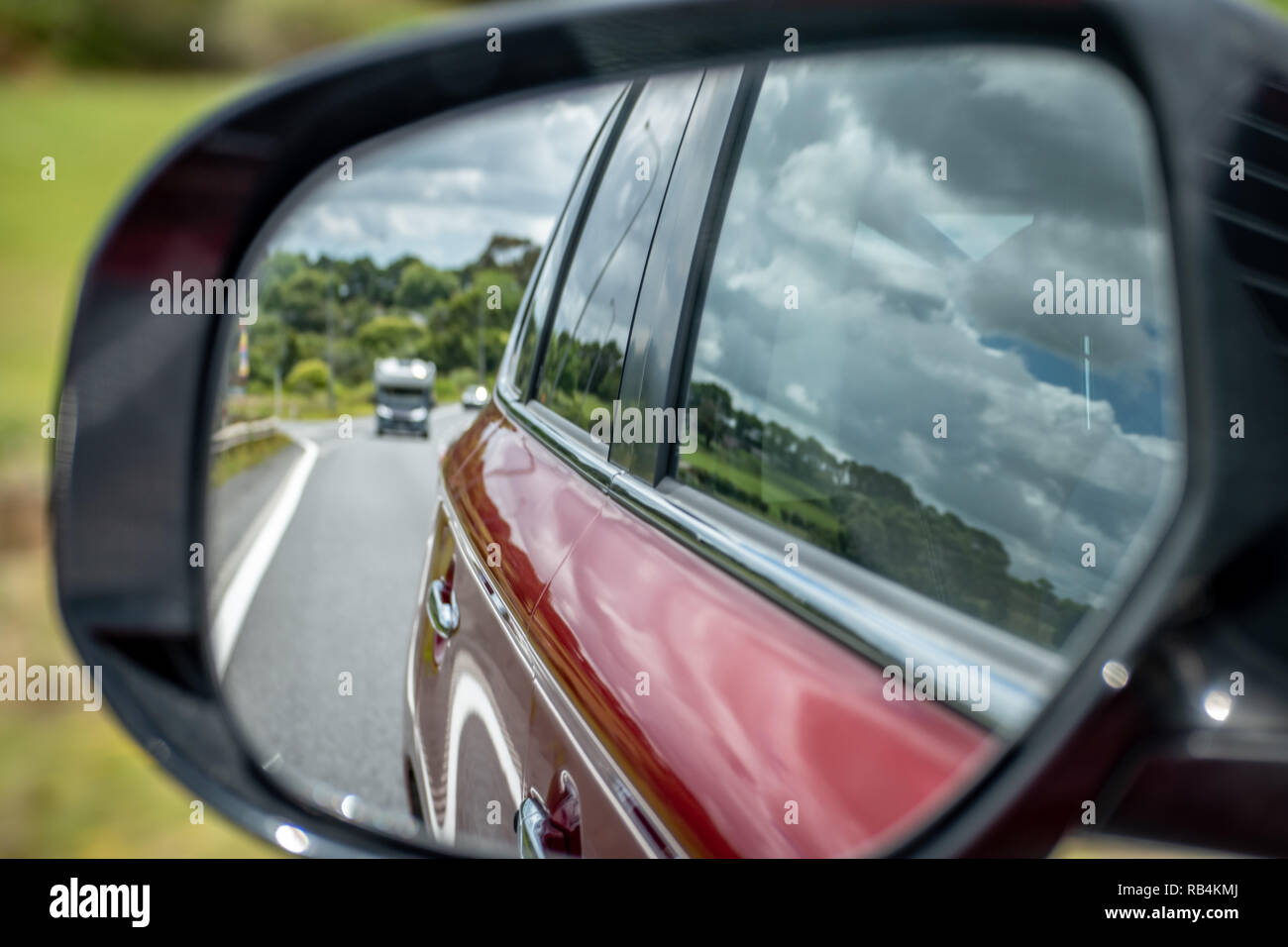 Photo of a car mirror during a drive Stock Photo