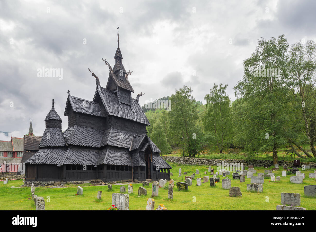Editorial: LAERDAL, SOGN OG FJORDANE, NORWAY, June 11, 2018 - The Borgund stave church seen from the cemetery with part of the Borgund church in the b Stock Photo