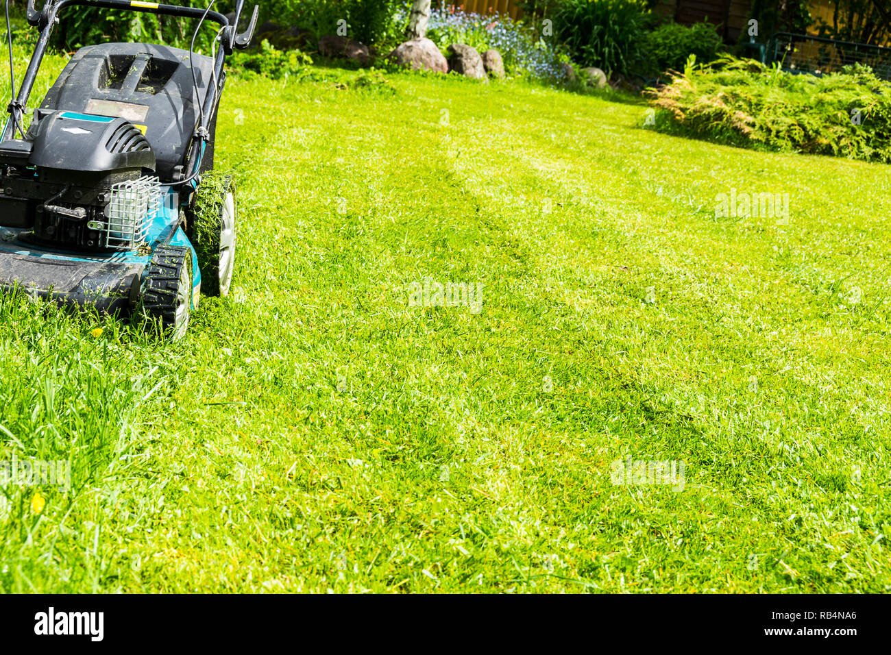Mowing lawns, Lawn mower on green grass, mower grass equipment, mowing