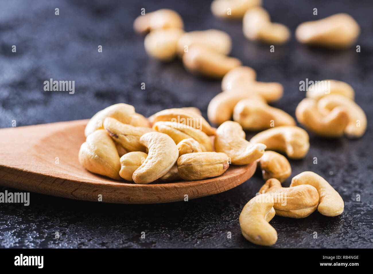 Roasted cashew nuts in wooden spoon Stock Photo Alamy