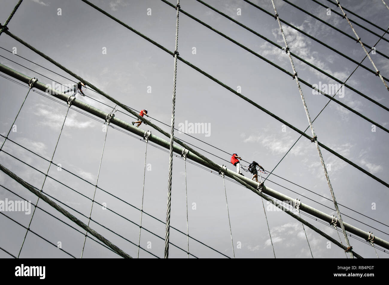 Climbers on the Brooklyn bridge cables, New York City, USA Stock Photo
