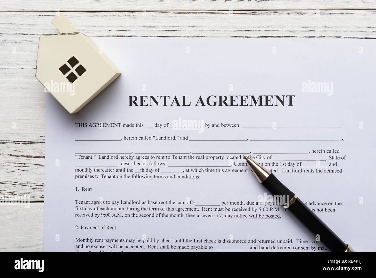 top view rental agreement contact with an architectural model and a pen Stock Photo