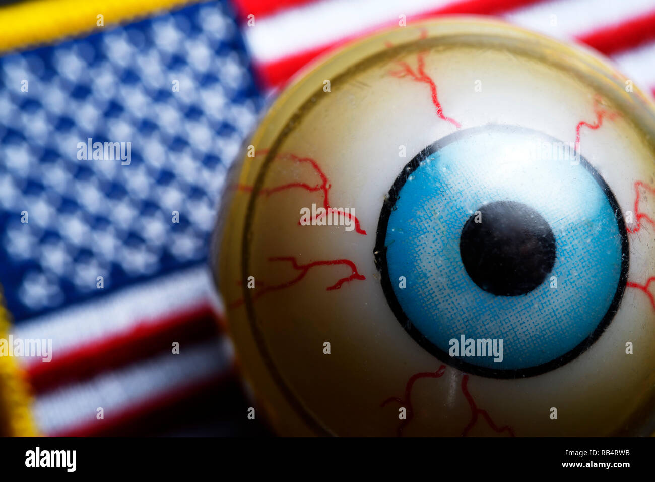 Eyeball on US flag, global policeman USA Stock Photo