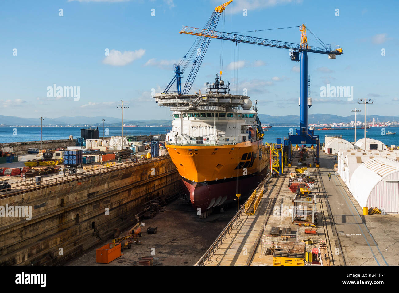Dry dock. SBM installer Vessel, support vessel being repaired in dry dock, British overseas territory of Gibraltar. Stock Photo
