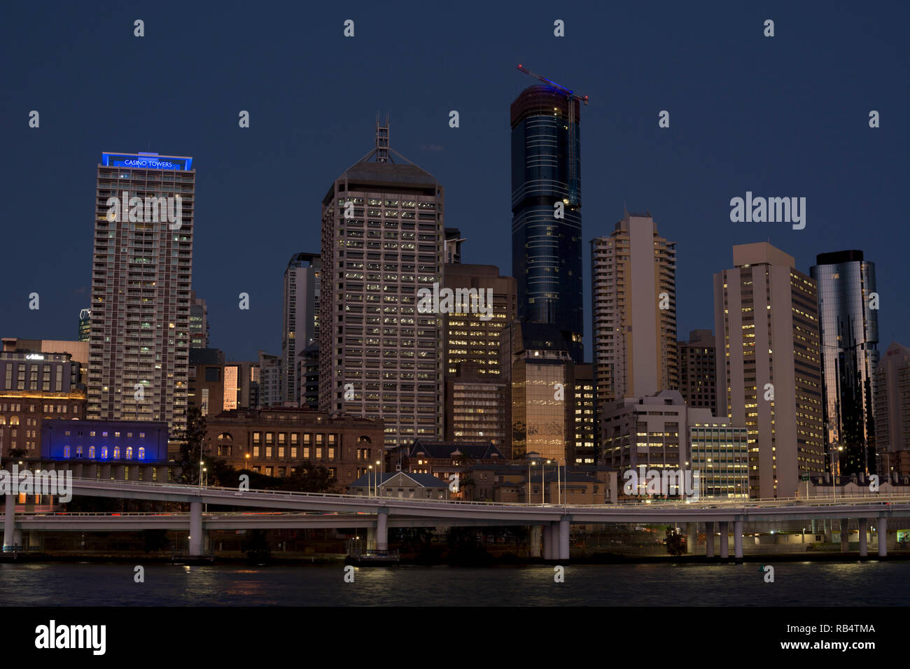 Brisbane city centre seen across Brisbane River at night, Queensland, Australia Stock Photo