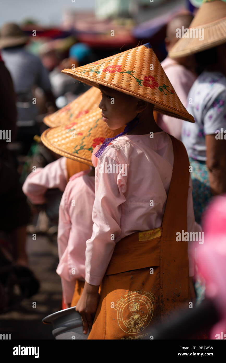 tail of children monks in the market, mandalay, myanmar Stock Photo