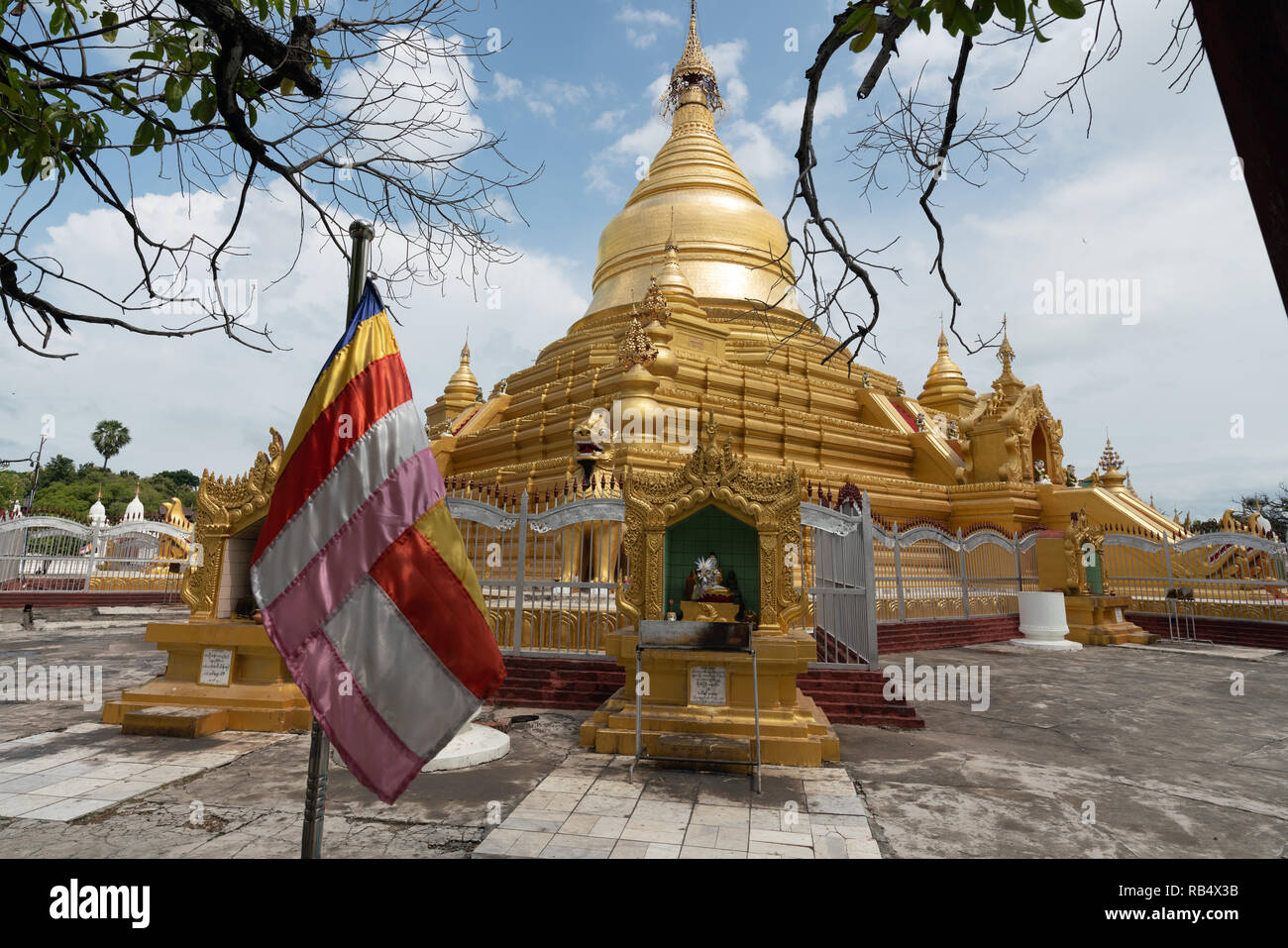 flag waving in kkuthodaw pagoda, mandalay, myanmar Stock Photo