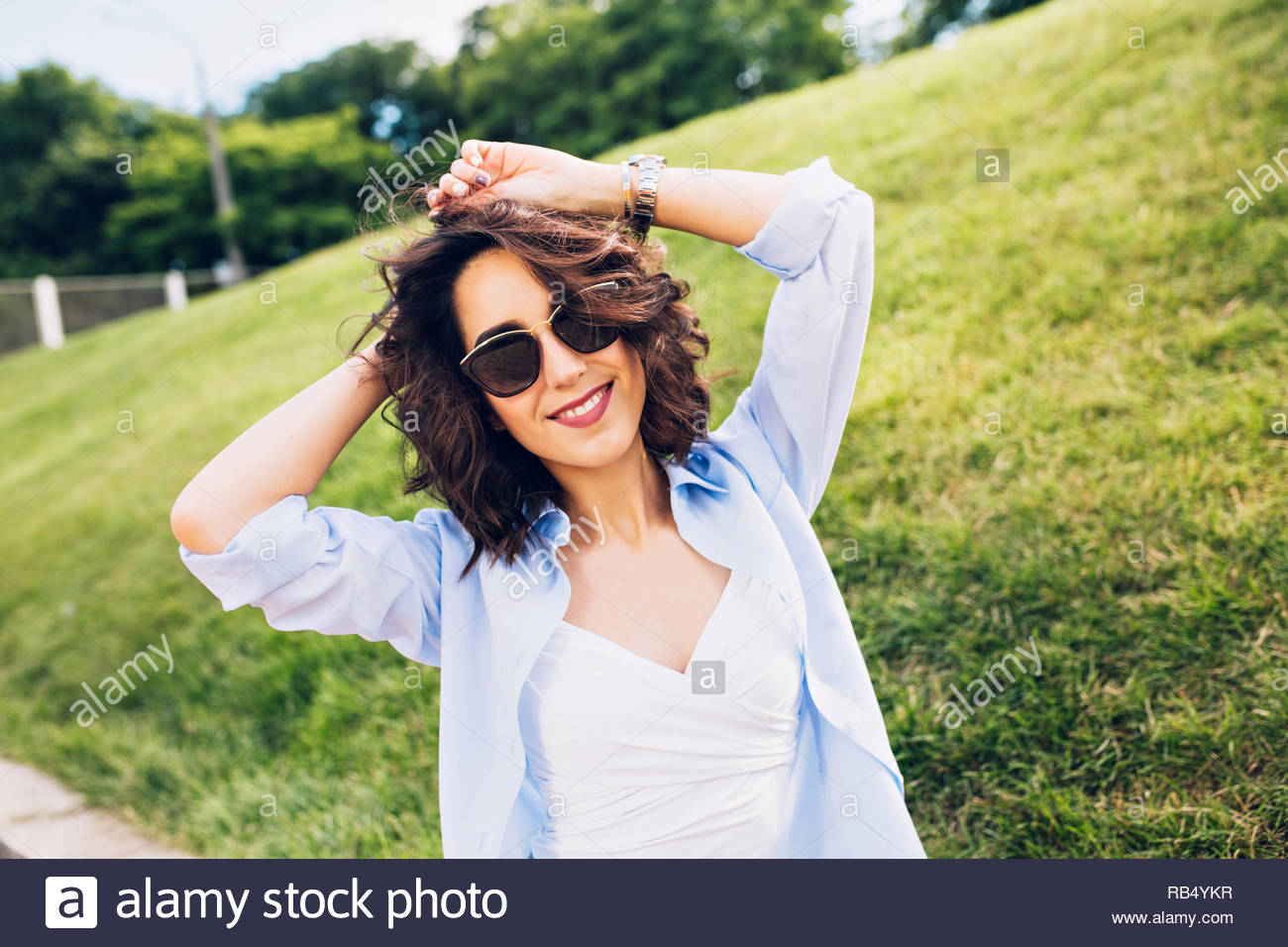 Portrait Of Nice Brunette Girl With Short Hair In Sunglasses