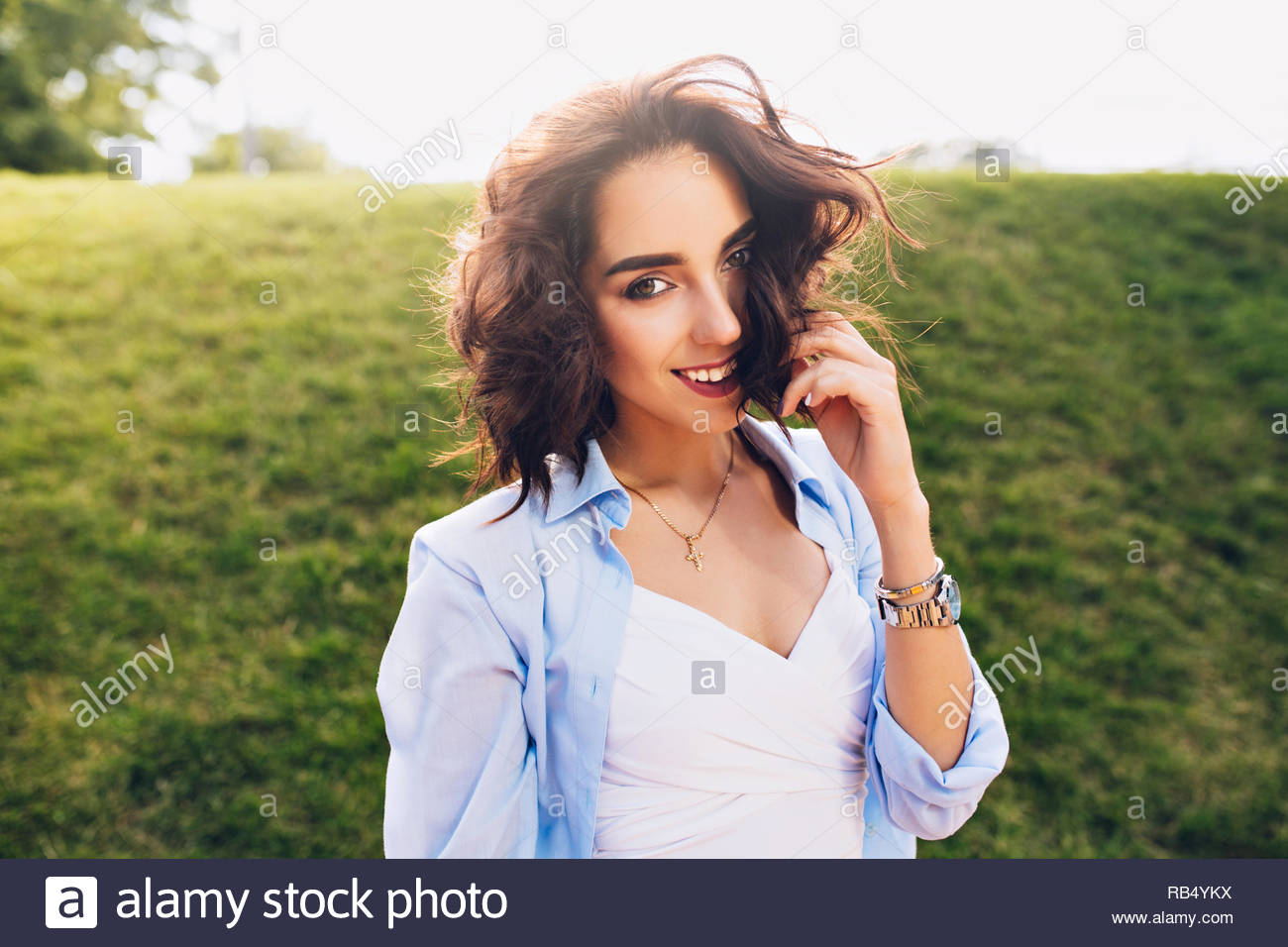 Portrait Of Cute Brunette Girl With Short Hair Posing To Camera In