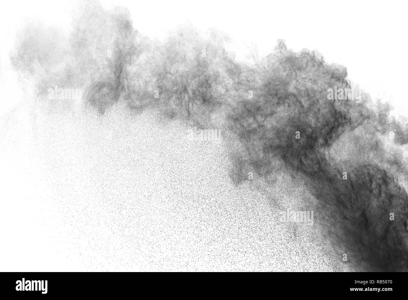 Black powder explosion against white background. Charcoal dust particle